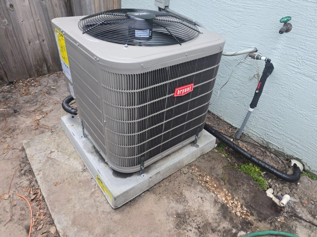 Bryant outdoor AC unit on a concrete pad