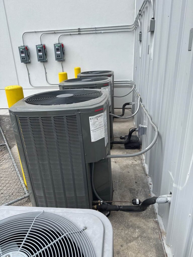Row of outdoor condenser units at a commercial building